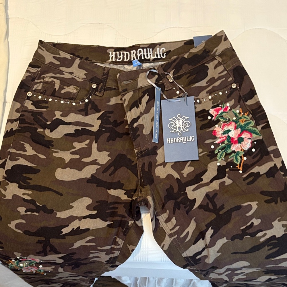 Hydraulic Camouflage Jeans with Floral Embroidery, Sizes 12 and 14 available.